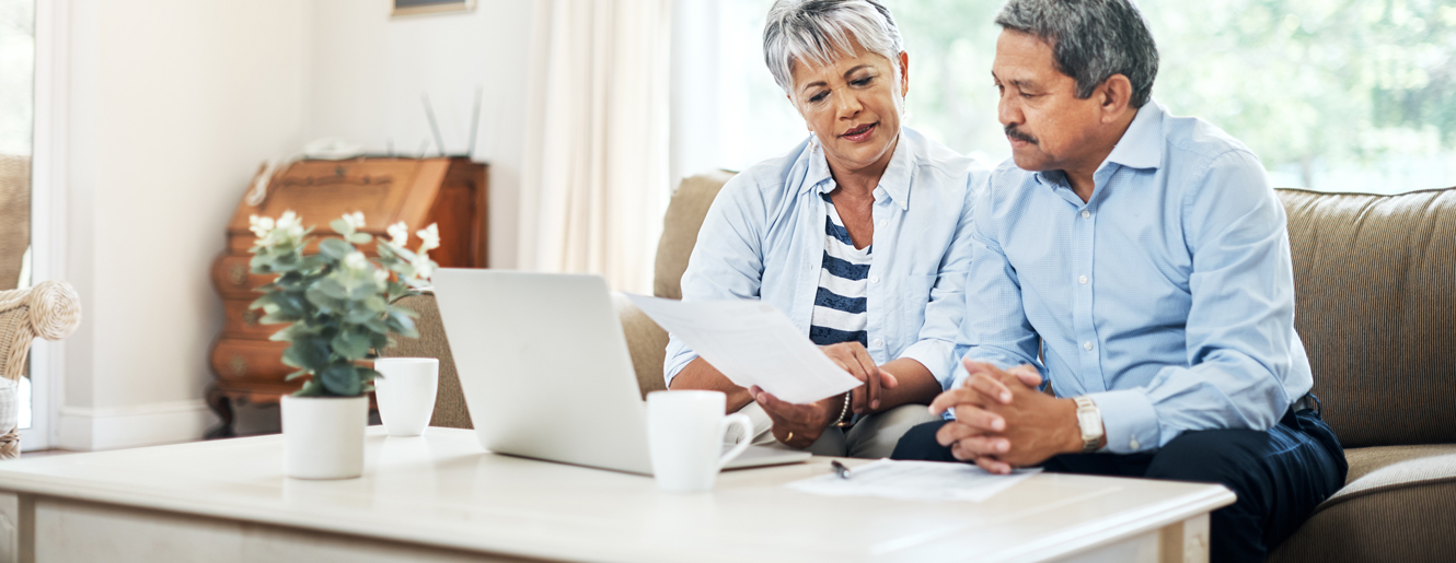 Couple looking at laptop.